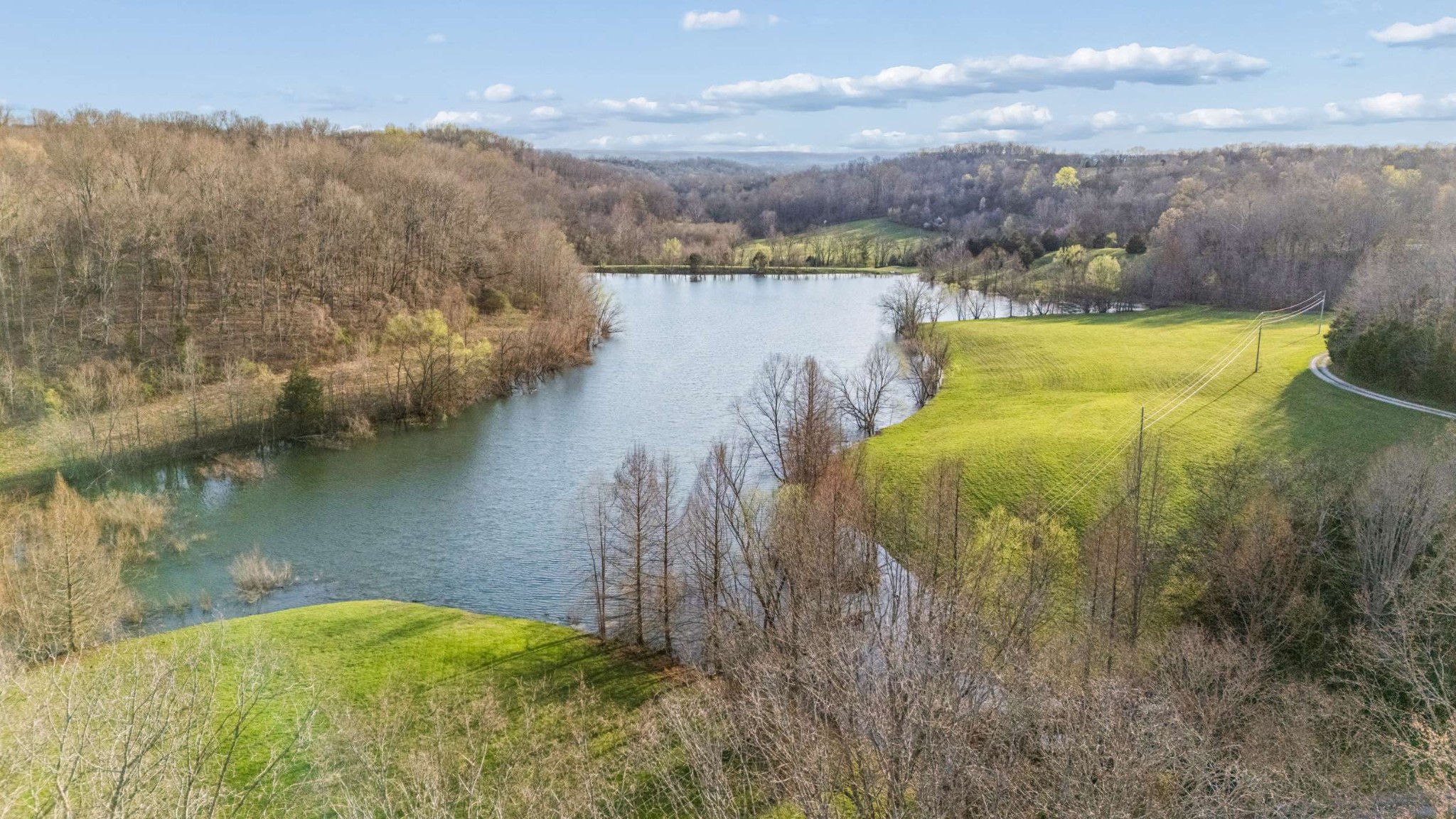 683 Johnson Branch Road Williamsport, TN 38487 - Photo 44 of 62 a view of a lake with a mountain in the background