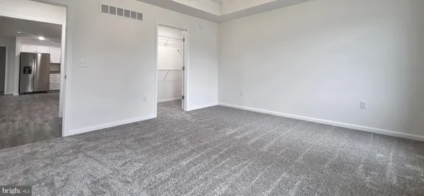 an empty room with a bathroom