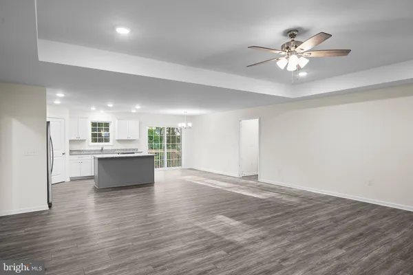 a view of kitchen with sink and wooden floor
