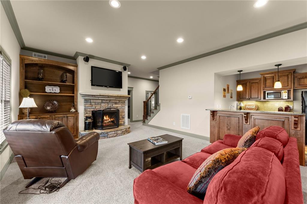 4529 Montclair Circle Gainesville, GA 30506 - Photo 23 of 34 a living room with furniture and a fireplace