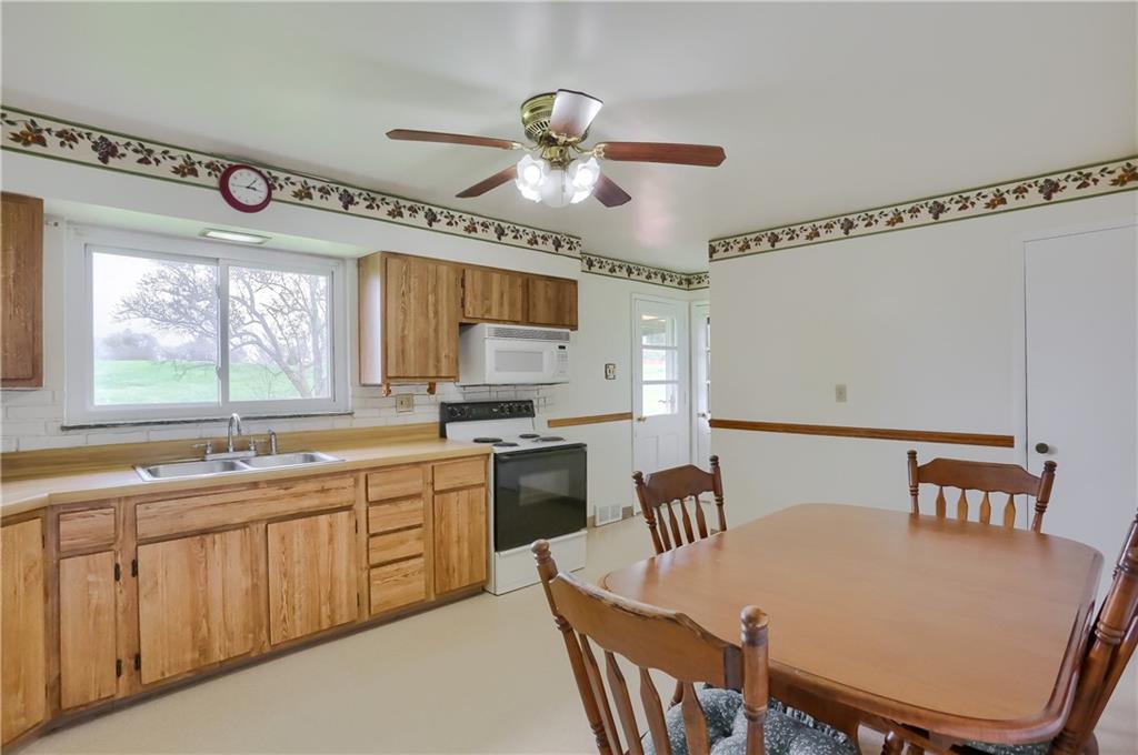 1022 Mercer Road Beaver Falls, PA 15010 - Photo 11 of 16 Eat in kitchen and door to back patio across from basement door and garage door