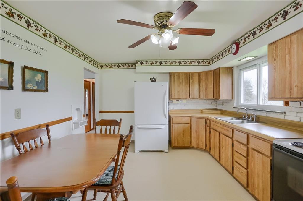 1022 Mercer Road Beaver Falls, PA 15010 - Photo 13 of 16 Roomy Eat in kitchen with great view of back yard and field