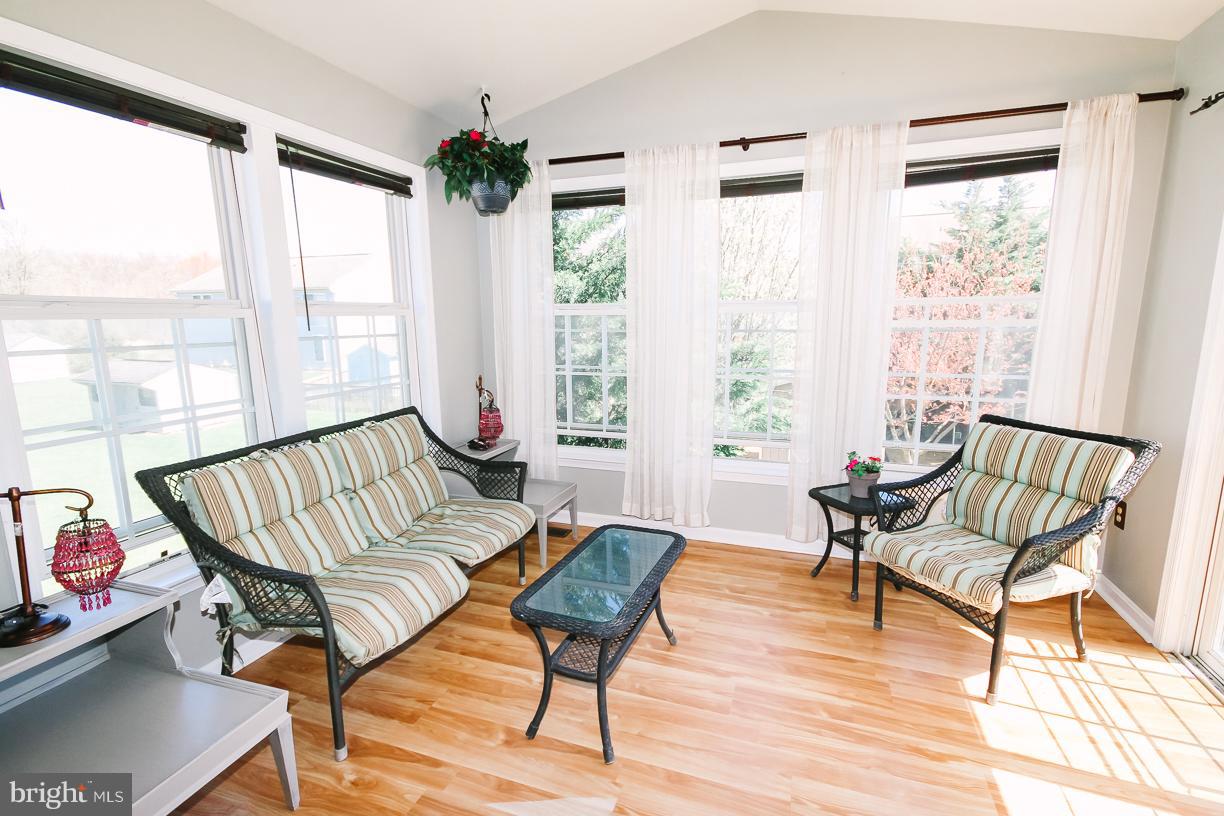 314 Huntinghorn Street Taneytown, MD 21787 - Photo 13 of 30 Sunroom leading to 2 tiered deck