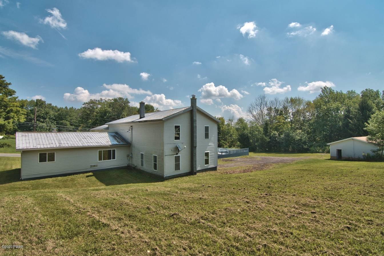 5690 Haas Pond Road Moscow, PA 18444 - Photo 68 of 79 a backyard of a house with table and chairs
