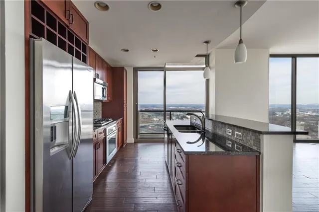 a kitchen with counter top space and stainless steel appliances