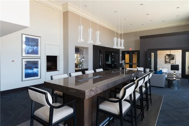 a dining room with furniture and wooden floor