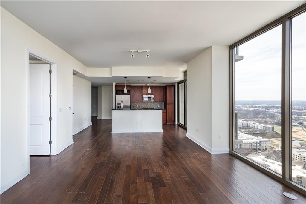 270 17th Street Northwest, Unit 3110 Atlanta, GA 30363 - Photo 5 of 23 a view of a kitchen with wooden floor and a window