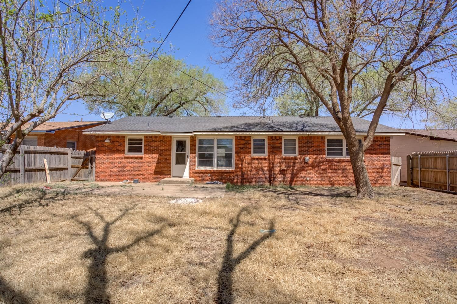 3011 44th Street Lubbock, TX 79413 - Photo 19 of 19 front view of a house with a large tree