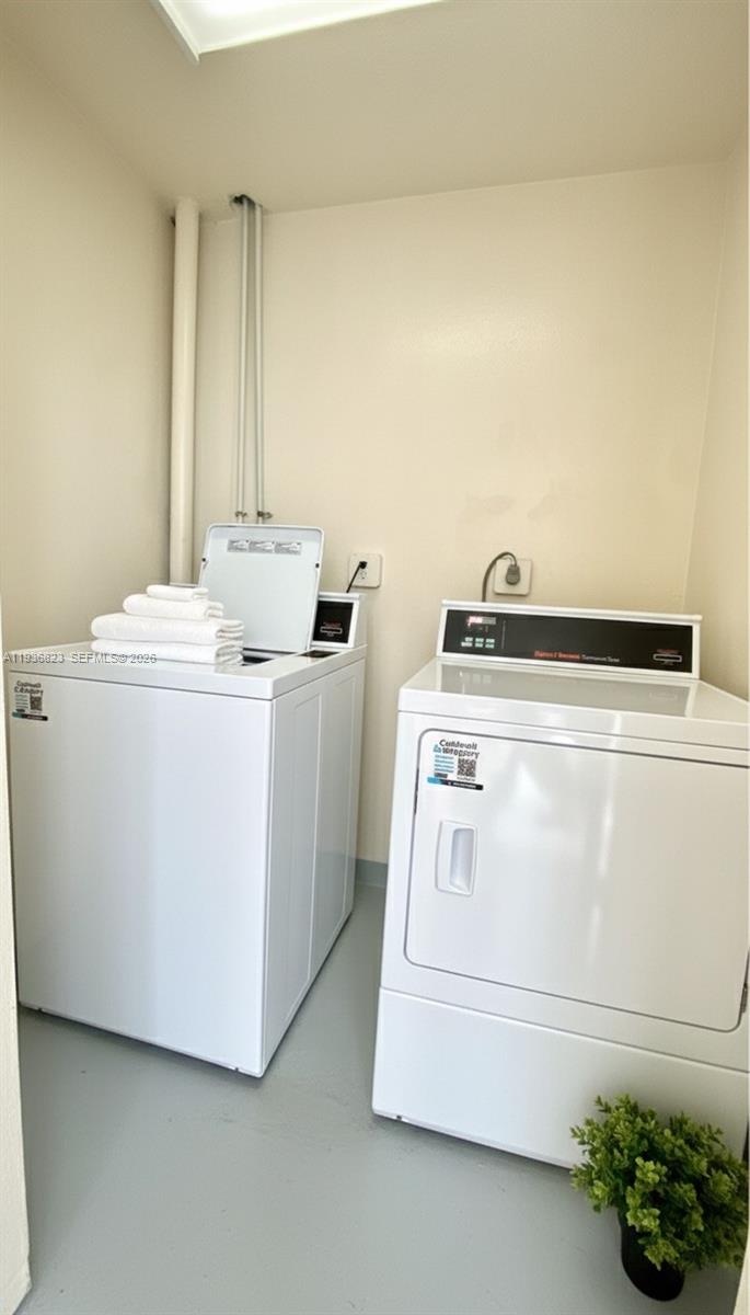 636 Northwest 13th Street, Unit 230 Boca Raton, FL 33486 - Photo 19 of 25 a utility room with dryer and washer