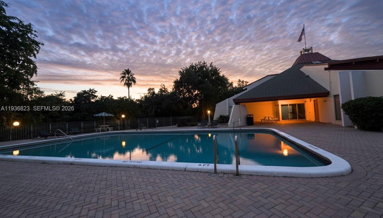 636 Northwest 13th Street, Unit 230 Boca Raton, FL 33486 - Photo 21 of 25 a view of swimming pool with seating space and yard in back