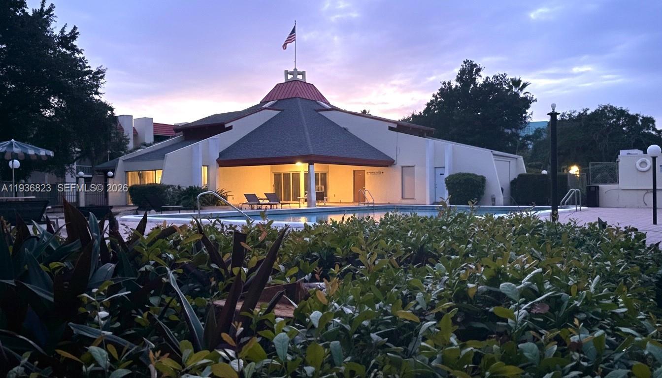 636 Northwest 13th Street, Unit 230 Boca Raton, FL 33486 - Photo 22 of 25 a front view of a house with a yard