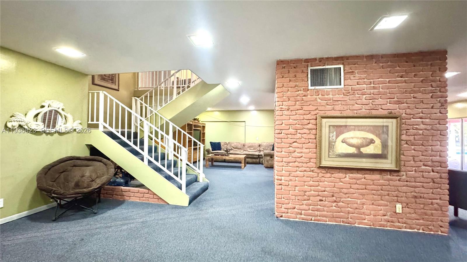 636 Northwest 13th Street, Unit 230 Boca Raton, FL 33486 - Photo 24 of 25 a view of livingroom with furniture and stairs