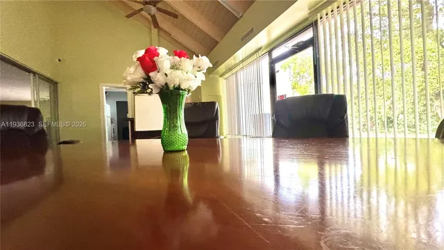 a living room with fireplace furniture and a chandelier