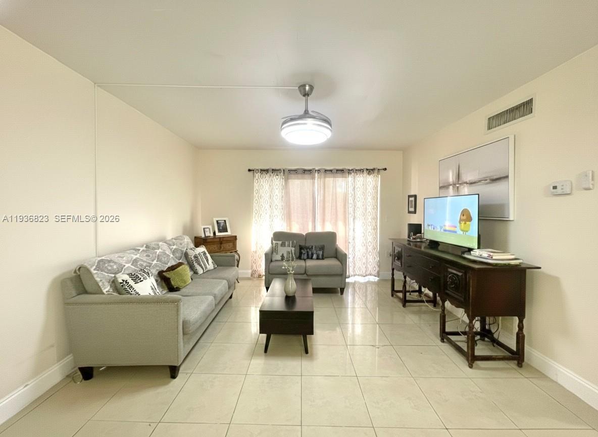 636 Northwest 13th Street, Unit 230 Boca Raton, FL 33486 - Photo 7 of 25 a living room with furniture and a window