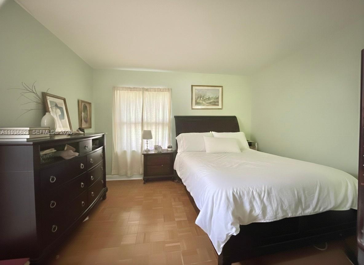 636 Northwest 13th Street, Unit 230 Boca Raton, FL 33486 - Photo 9 of 25 a bedroom with a bed and a window