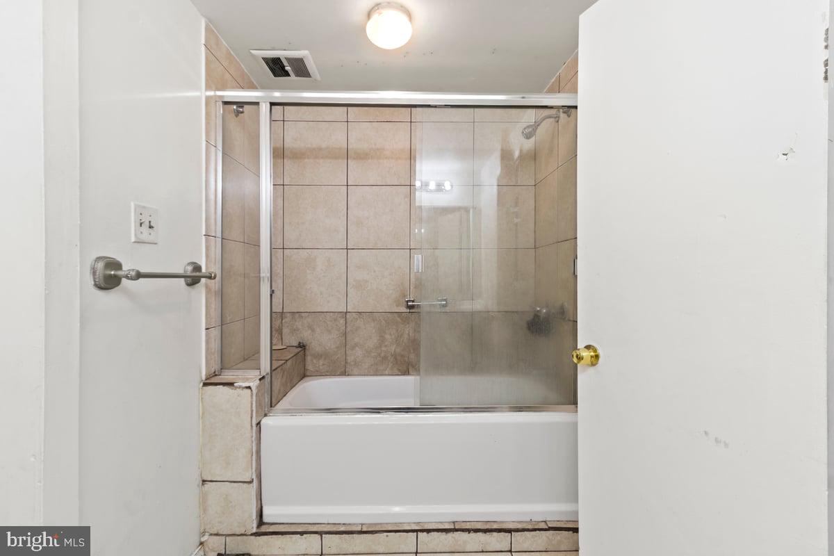 49 Fairmount Drive Willingboro, NJ 08046 - Photo 15 of 19 a bathroom with a shower and a bath tub