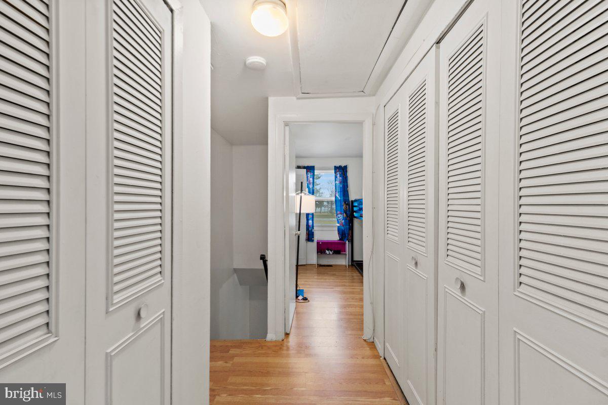 49 Fairmount Drive Willingboro, NJ 08046 - Photo 17 of 19 a view of a hallway with wooden floor and closet