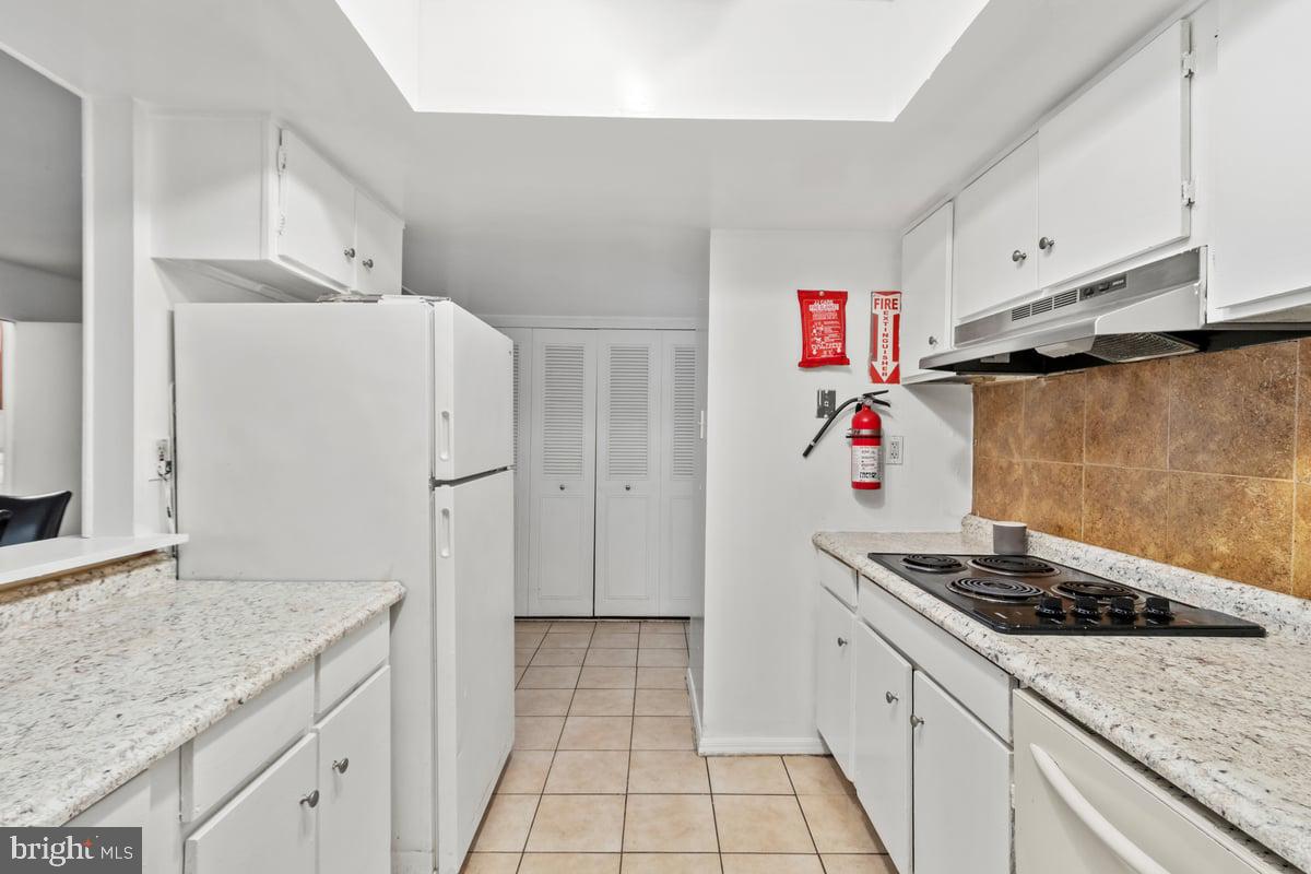 49 Fairmount Drive Willingboro, NJ 08046 - Photo 7 of 19 a kitchen with stainless steel appliances granite countertop a refrigerator and a sink