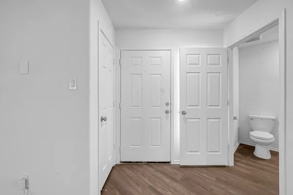 a view of room with wooden floor