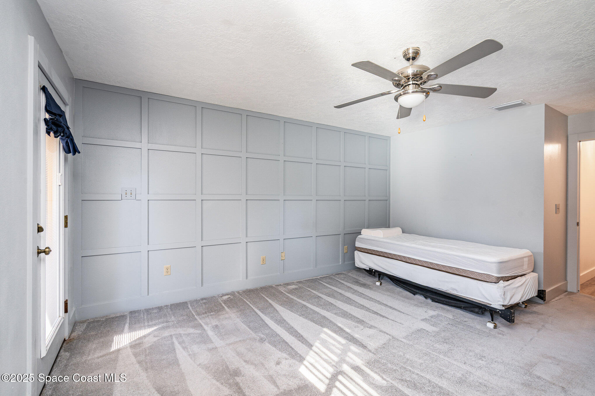 2515 Fairfield Drive Cocoa, FL 32926 - Photo 13 of 31 a bedroom with a bed and a window