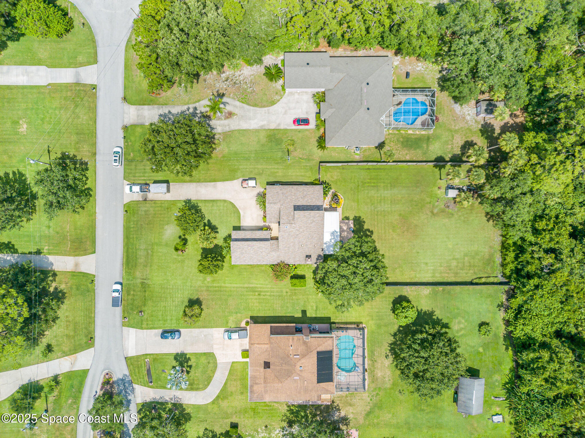 2515 Fairfield Drive Cocoa, FL 32926 - Photo 24 of 31 an aerial view of residential house with outdoor space and swimming pool