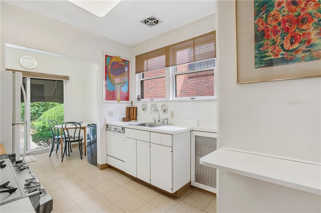 1232 Murdoch Road Pittsburgh, PA 15217 - Photo 11 of 38 a kitchen with a cabinets and window