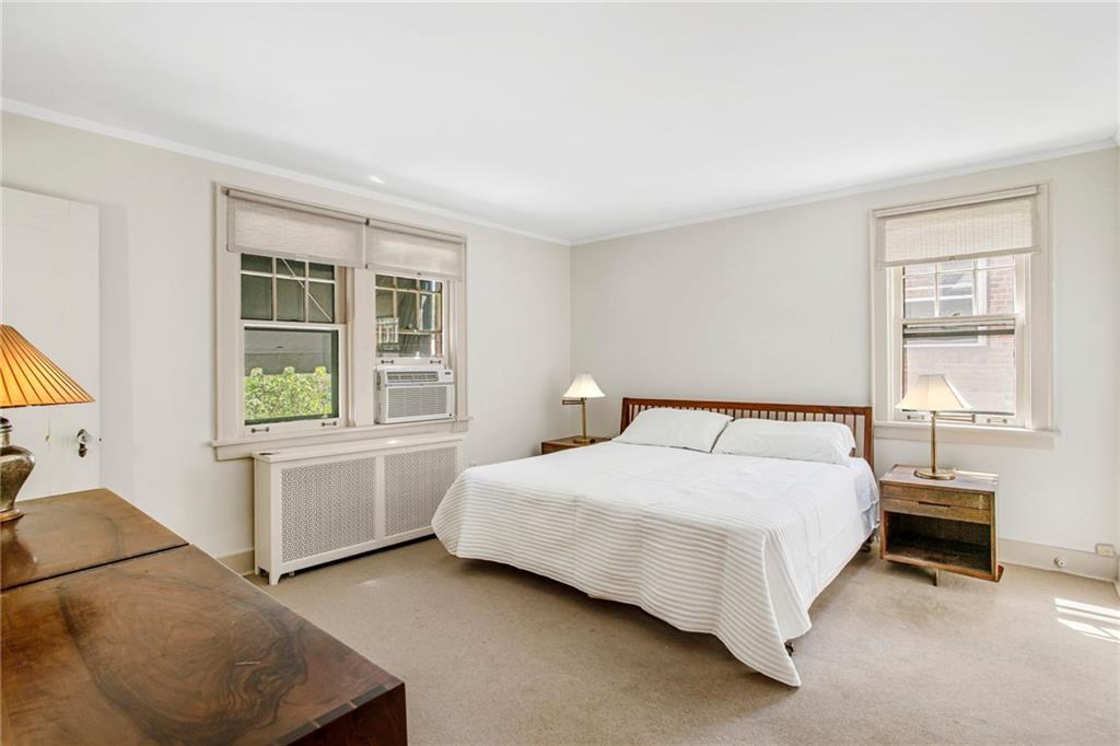 1232 Murdoch Road Pittsburgh, PA 15217 - Photo 16 of 38 a bedroom with a bed and a window