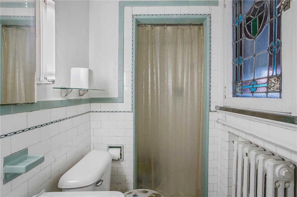 1232 Murdoch Road Pittsburgh, PA 15217 - Photo 18 of 38 a bathroom with a granite countertop sink and a toilet