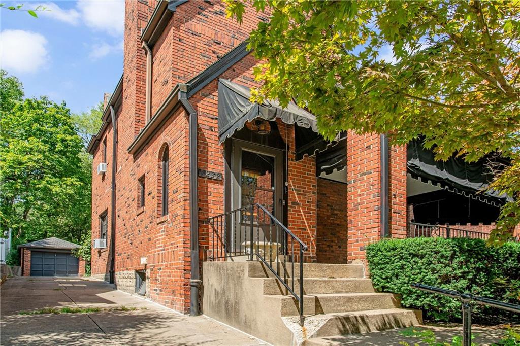 1232 Murdoch Road Pittsburgh, PA 15217 - Photo 2 of 38 a front view of a house with a yard