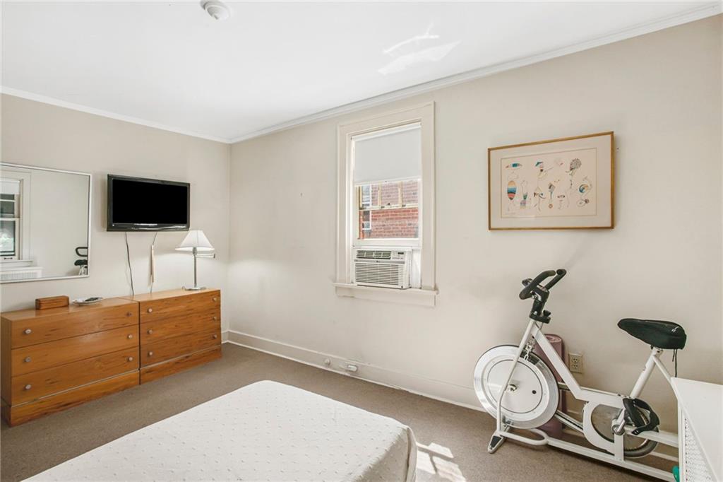 1232 Murdoch Road Pittsburgh, PA 15217 - Photo 21 of 38 a view of a livingroom with furniture and a flat screen tv