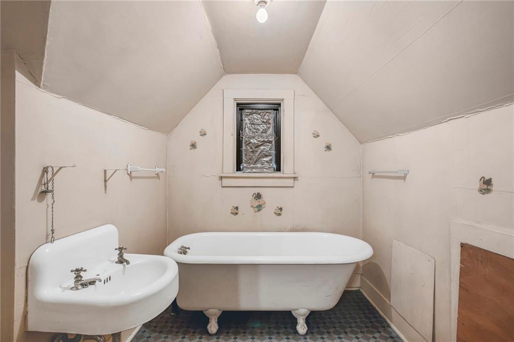 1232 Murdoch Road Pittsburgh, PA 15217 - Photo 26 of 38 a bathroom with a sink and mirror with toilet