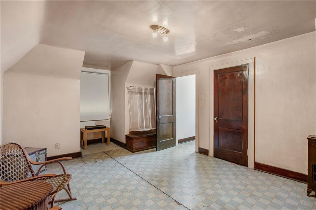 1232 Murdoch Road Pittsburgh, PA 15217 - Photo 27 of 38 a view of a livingroom with furniture and an empty room