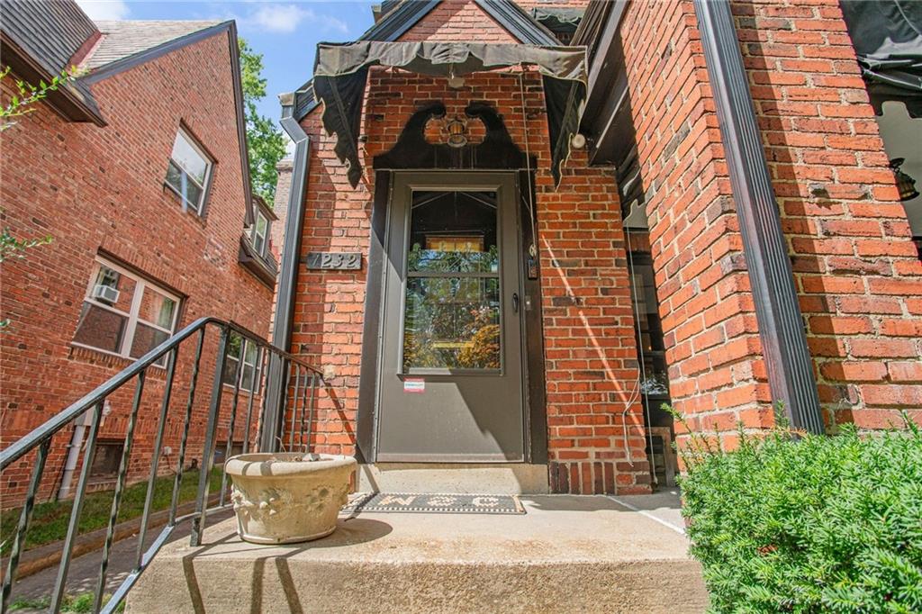 1232 Murdoch Road Pittsburgh, PA 15217 - Photo 3 of 38 a front view of a house with a yard