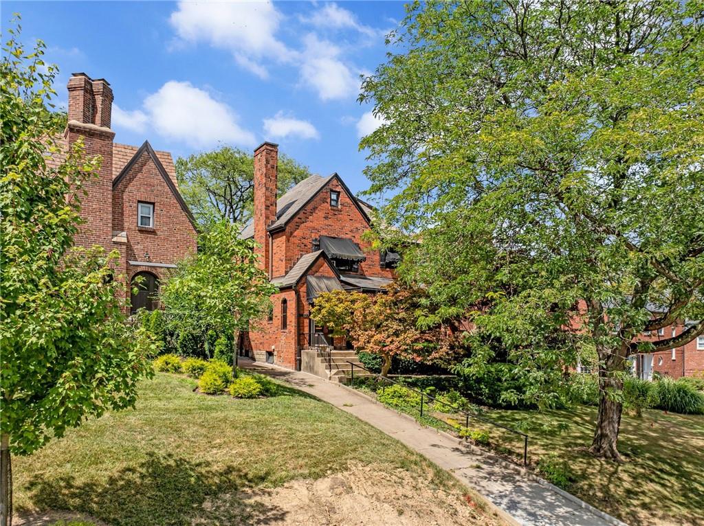 1232 Murdoch Road Pittsburgh, PA 15217 - Photo 38 of 38 a front view of a house with a yard