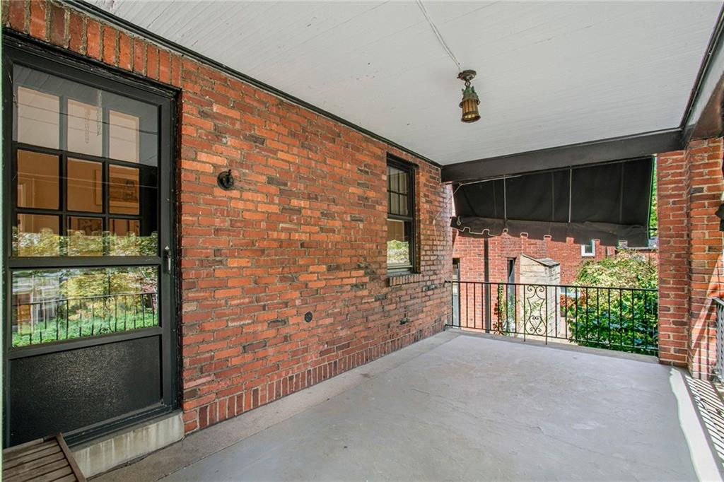 1232 Murdoch Road Pittsburgh, PA 15217 - Photo 4 of 38 a view of a porch with a door