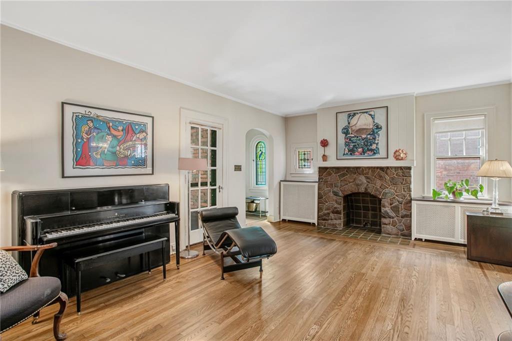 1232 Murdoch Road Pittsburgh, PA 15217 - Photo 7 of 38 a living room with furniture and a fireplace