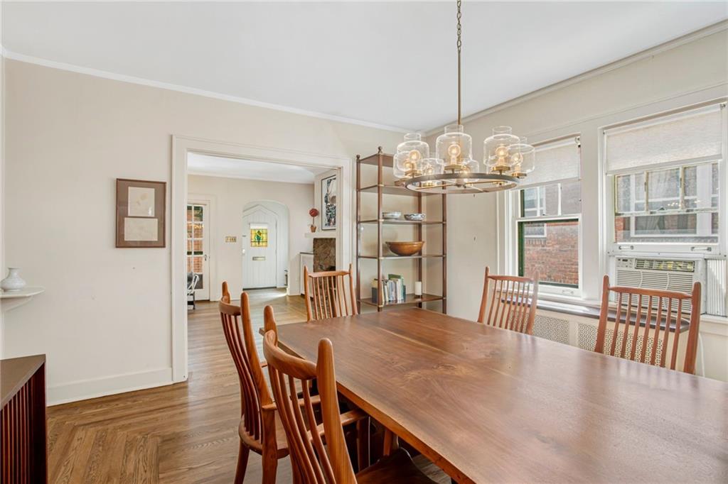 1232 Murdoch Road Pittsburgh, PA 15217 - Photo 9 of 38 a view of a dining room with furniture wooden floor and chandelier