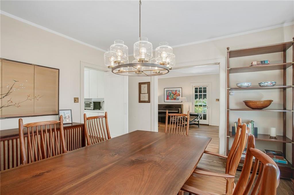 1232 Murdoch Road Pittsburgh, PA 15217 - Photo 10 of 38 a view of a dining room with furniture and chandelier