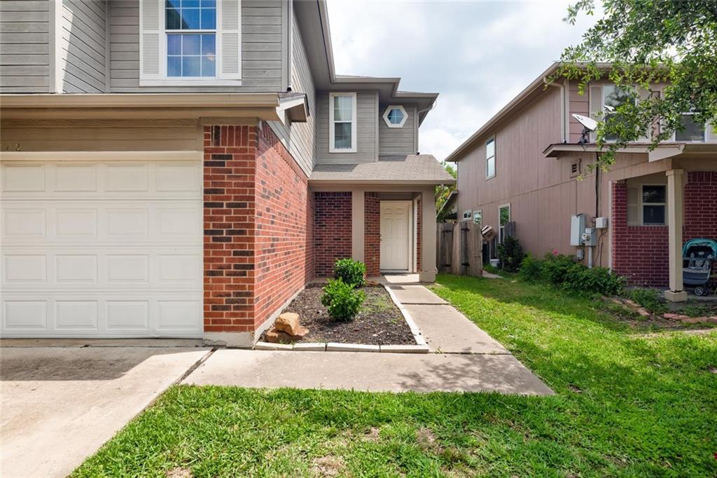 16712 Hamilton Point Circle Manor, TX 78653 - Photo 2 of 38 Brick accents and a paved walkway define the classic facade of this multi-level home.