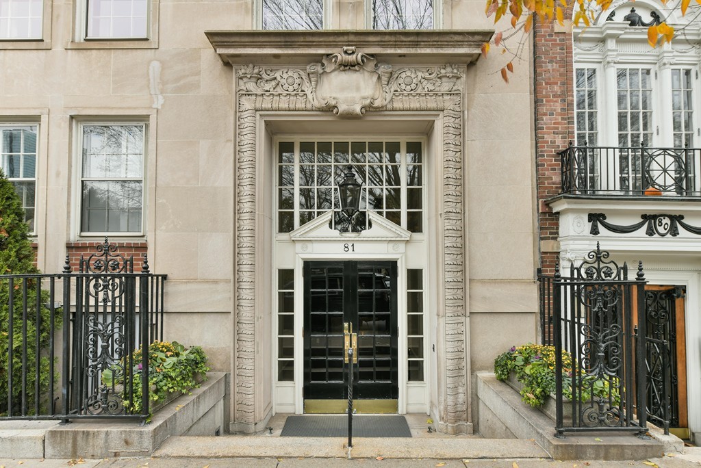 a front view of a building with potted plants