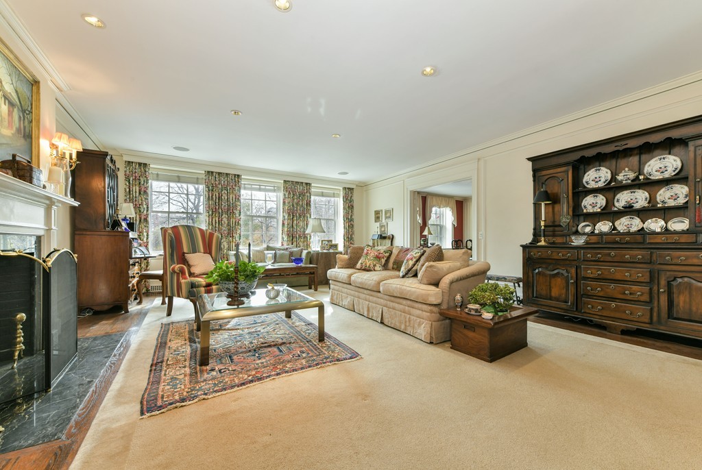 81 Beacon Street, Unit 3 Boston, MA 02108 - Photo 3 of 7 a living room with furniture a fireplace and a flat screen tv