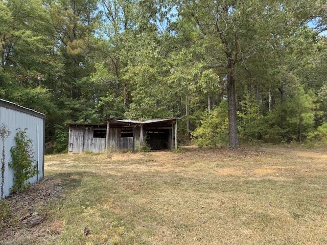 370 Doyle Road Middleton, TN 38052 - Photo 11 of 17 a house with trees in the background