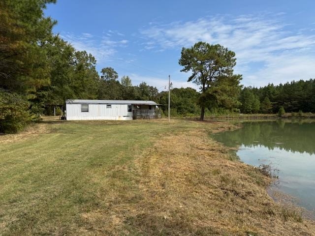 370 Doyle Road Middleton, TN 38052 - Photo 5 of 17 a view of a lake with houses in the background