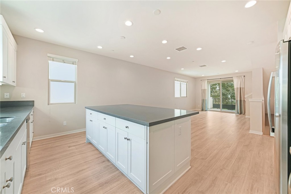 143 Frame Irvine, CA 92618 - Photo 6 of 41 a kitchen with granite countertop a stove and a sink
