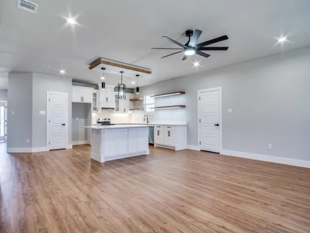 a view of kitchen with wooden floor and window