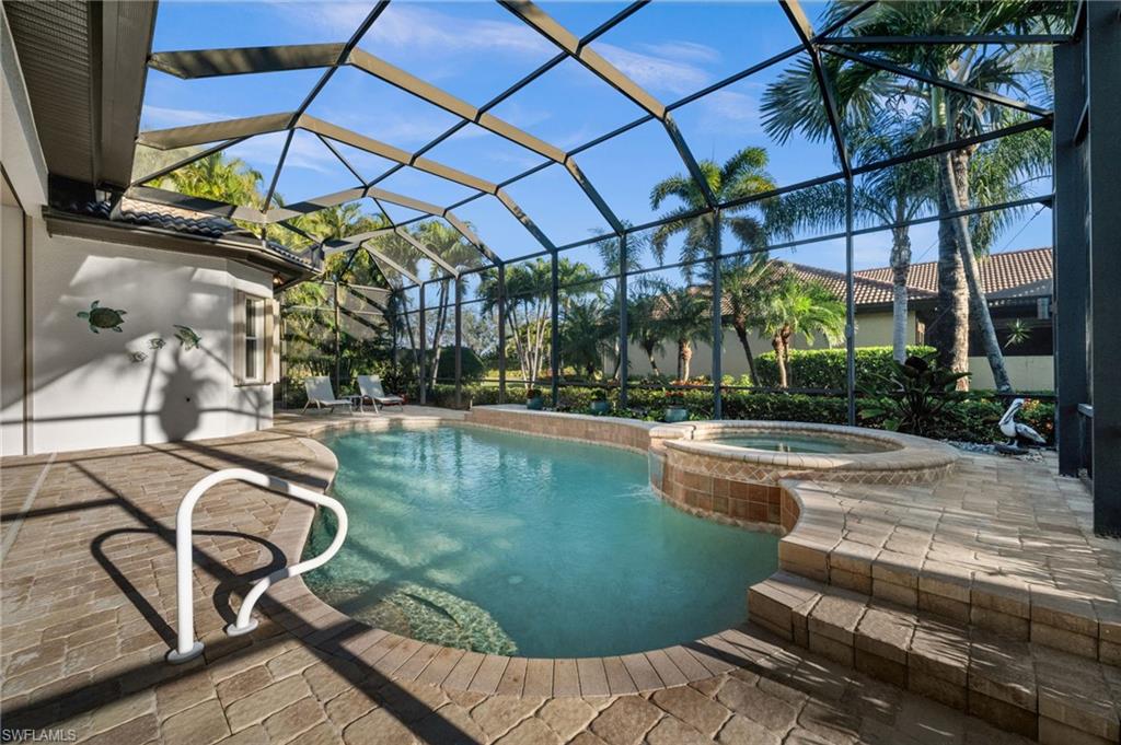12553 Grandezza Circle Estero, FL 33928 - Photo 18 of 46 a view of a swimming pool with a patio