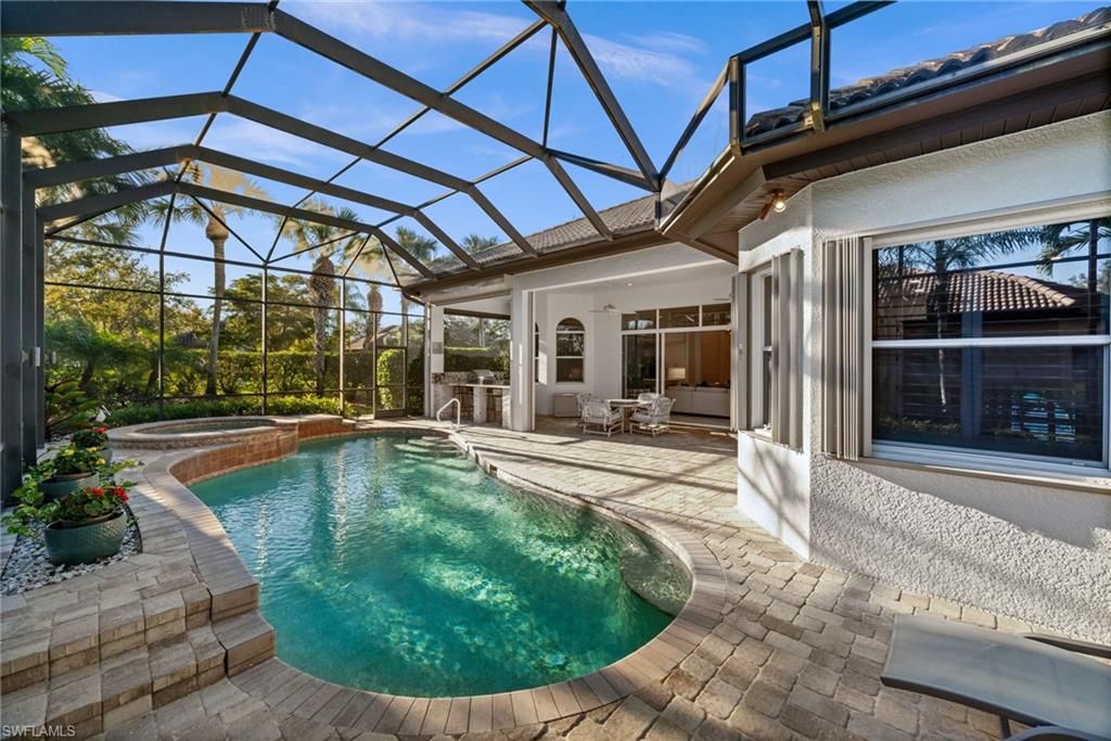 12553 Grandezza Circle Estero, FL 33928 - Photo 20 of 46 a view of a backyard patio with swimming pool