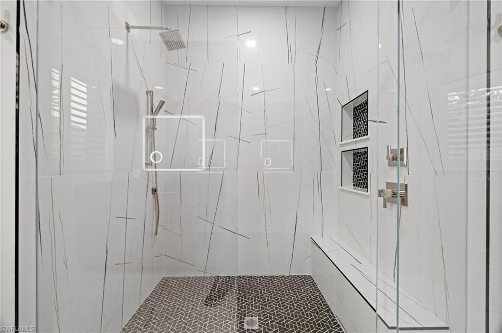 12553 Grandezza Circle Estero, FL 33928 - Photo 27 of 46 a bathroom with a shower and a toilet