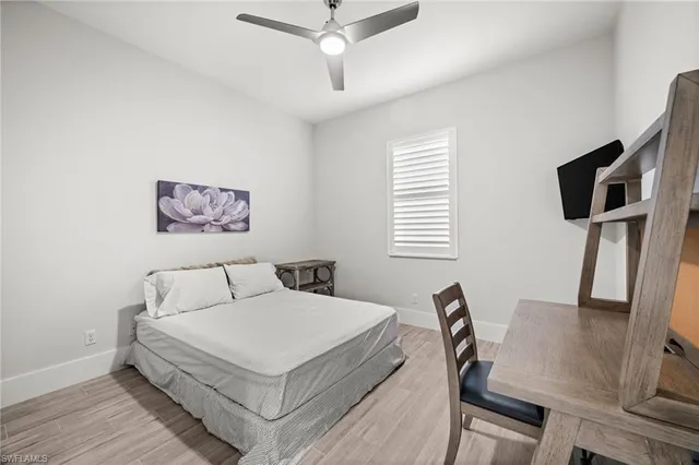 a room that has a bed and a chair in it