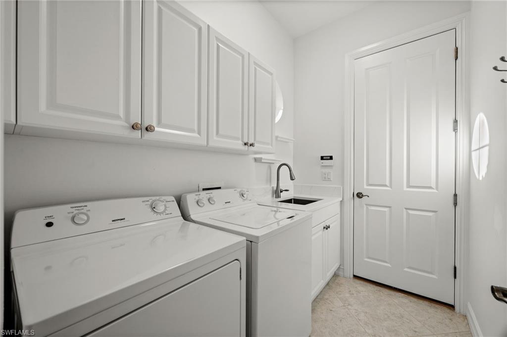 12553 Grandezza Circle Estero, FL 33928 - Photo 33 of 46 a view of utility room with washer and dryer